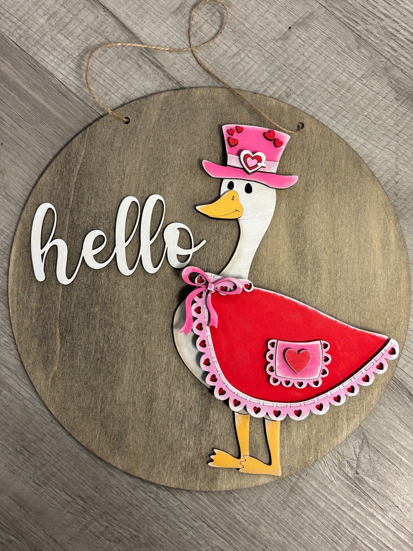 Interchangeable goose door hanger