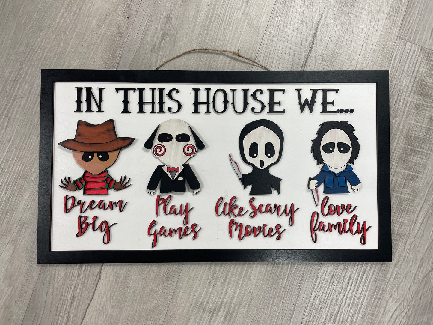 In this house…horror sign