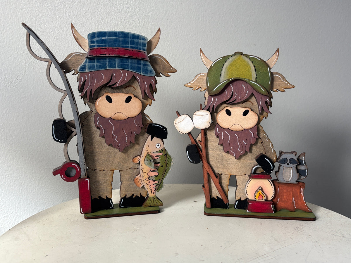 Camping and fishing standing highland cow