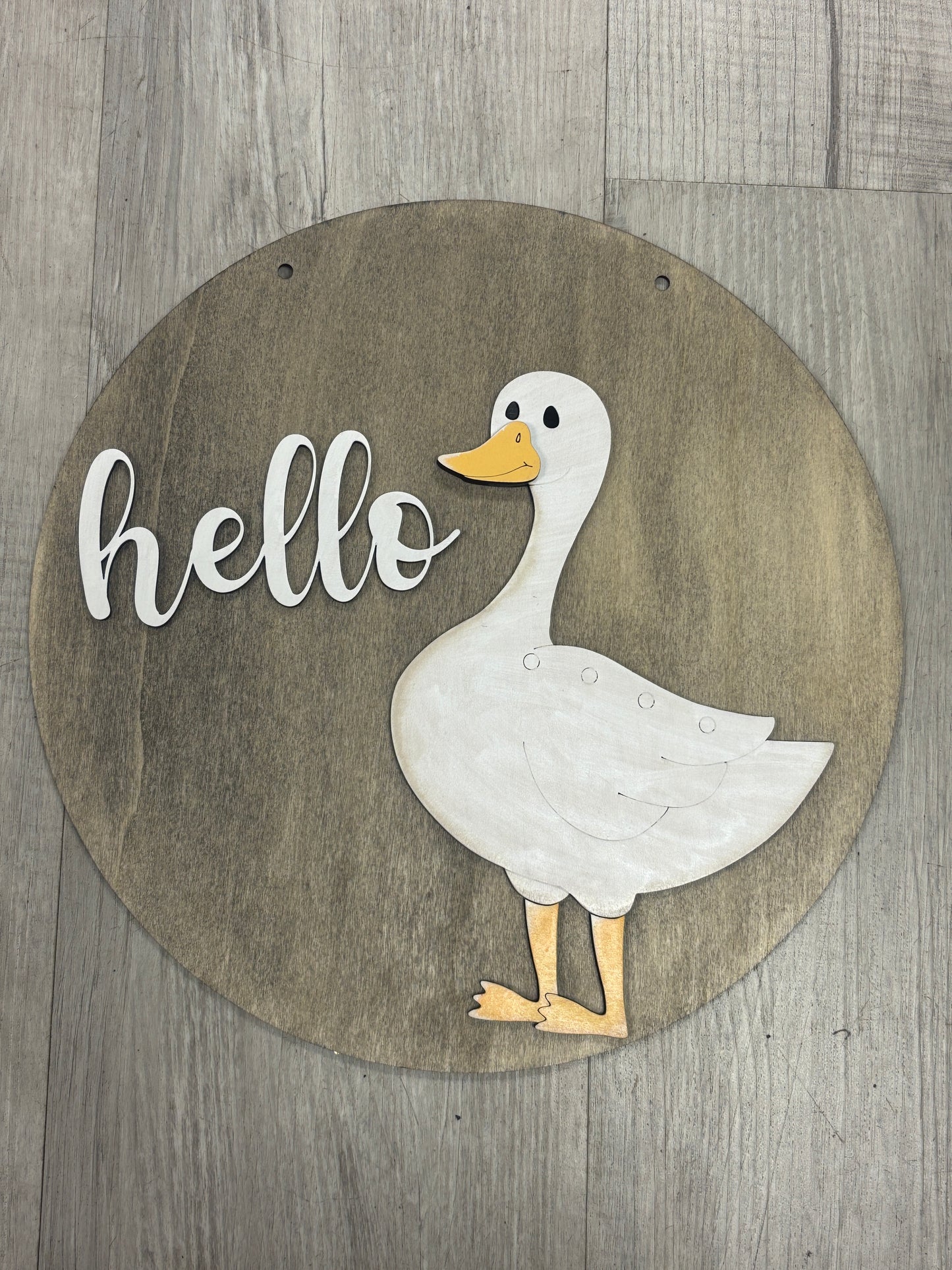 Interchangeable goose door hanger