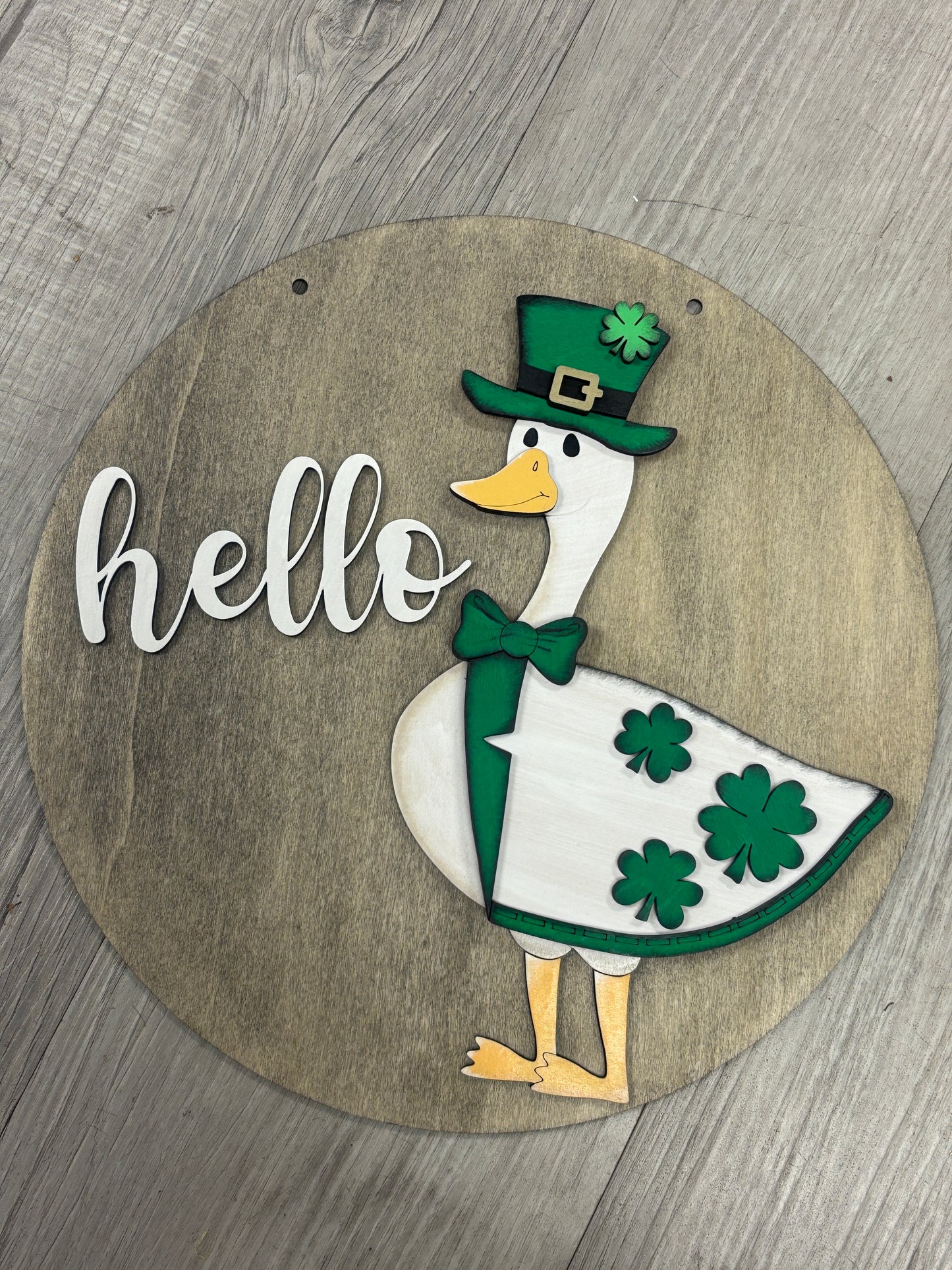 Interchangeable goose door hanger