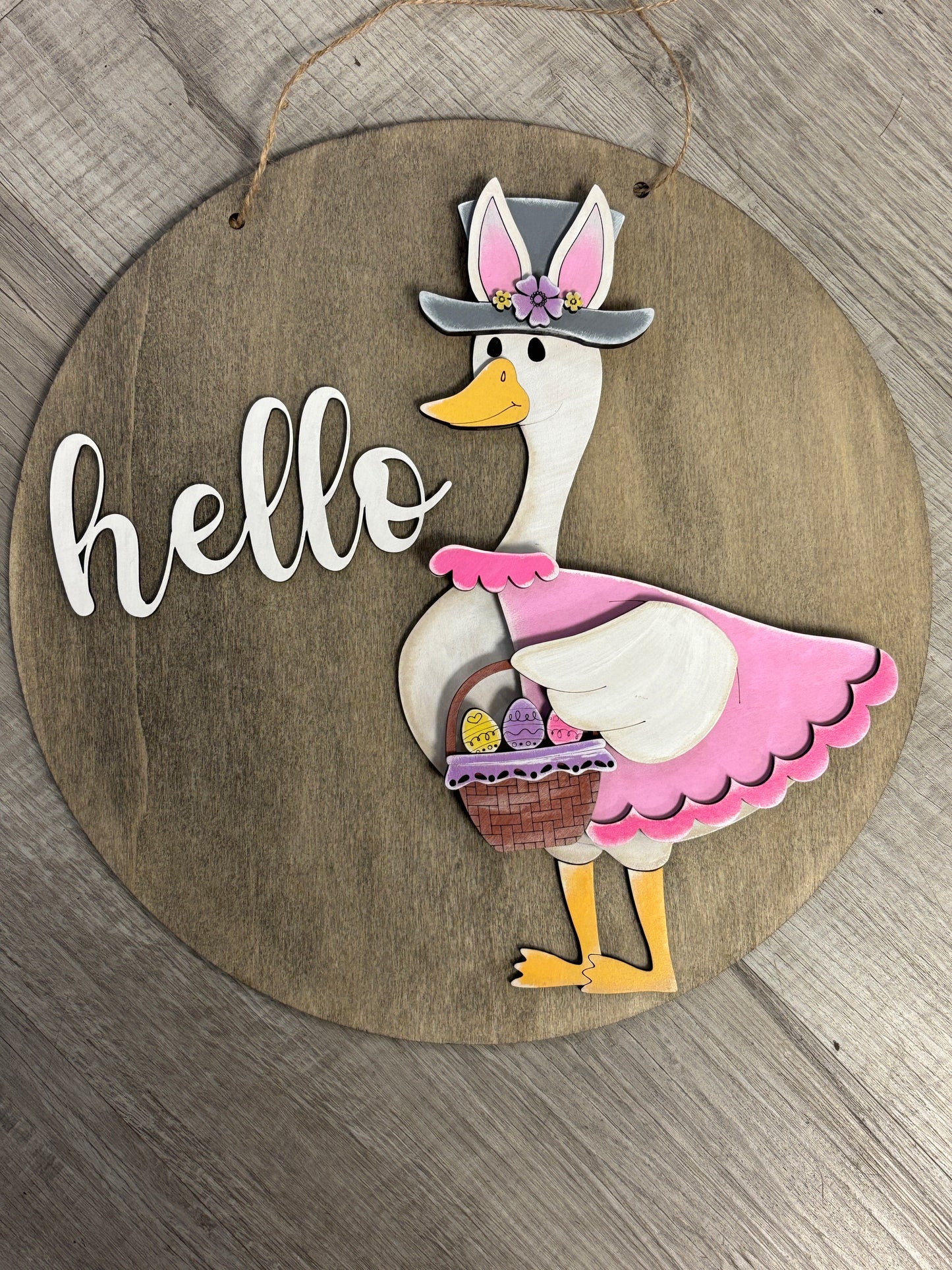 Interchangeable goose door hanger