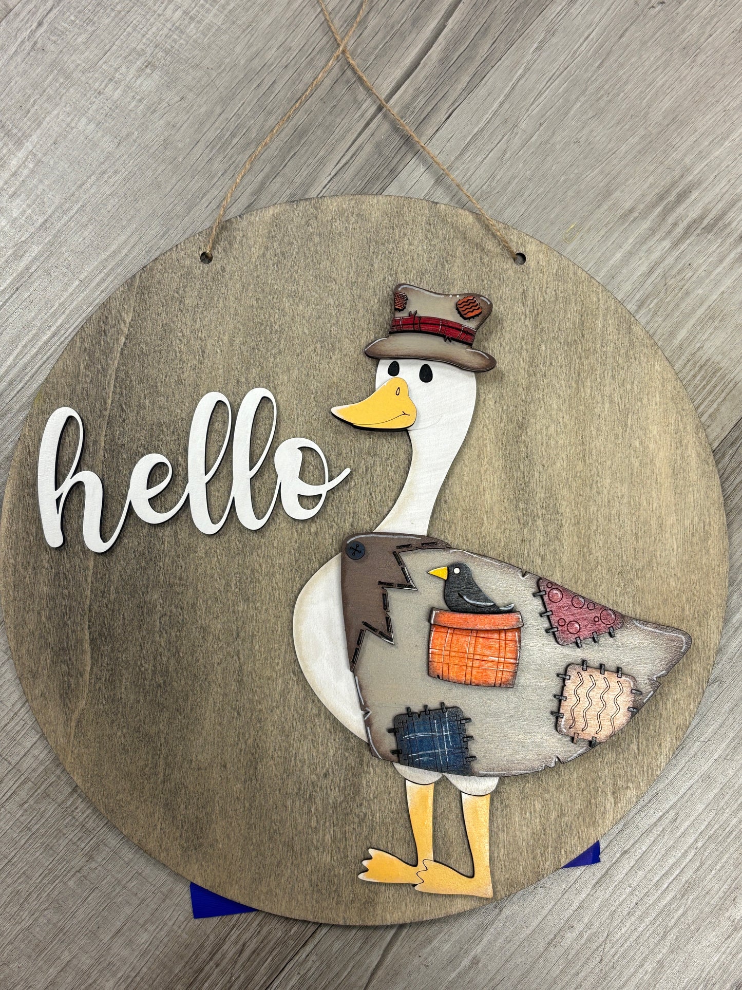 Interchangeable goose door hanger