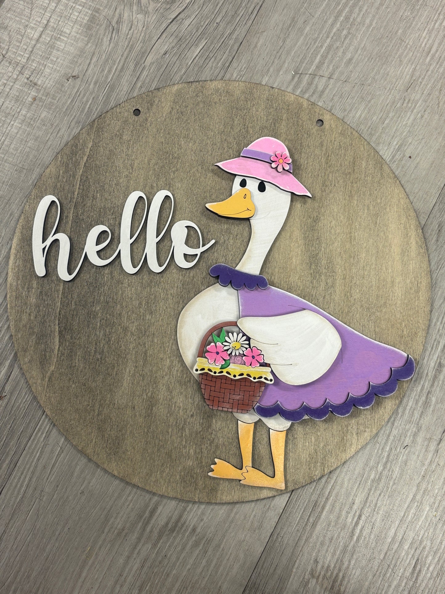 Interchangeable goose door hanger