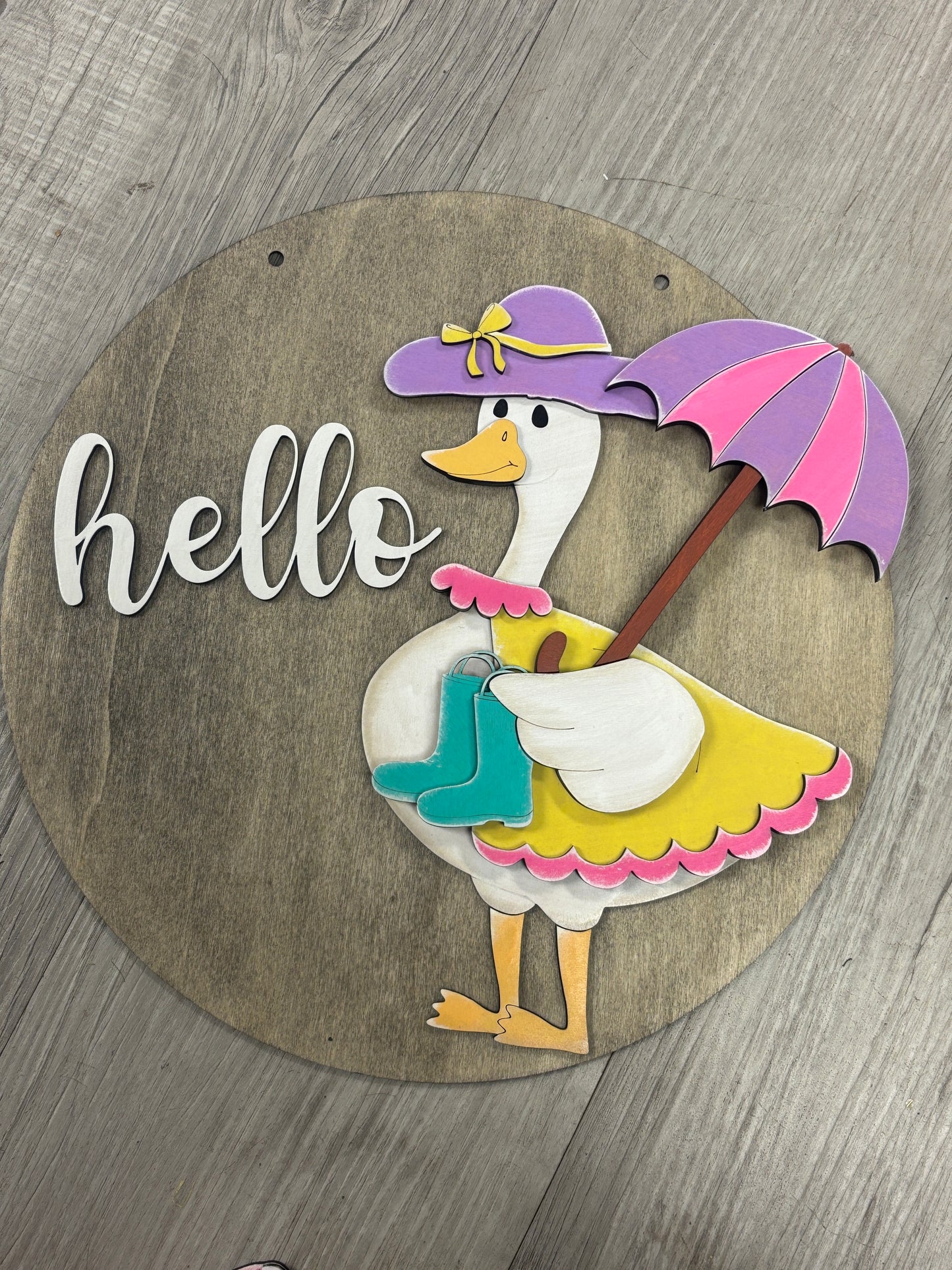Interchangeable goose door hanger
