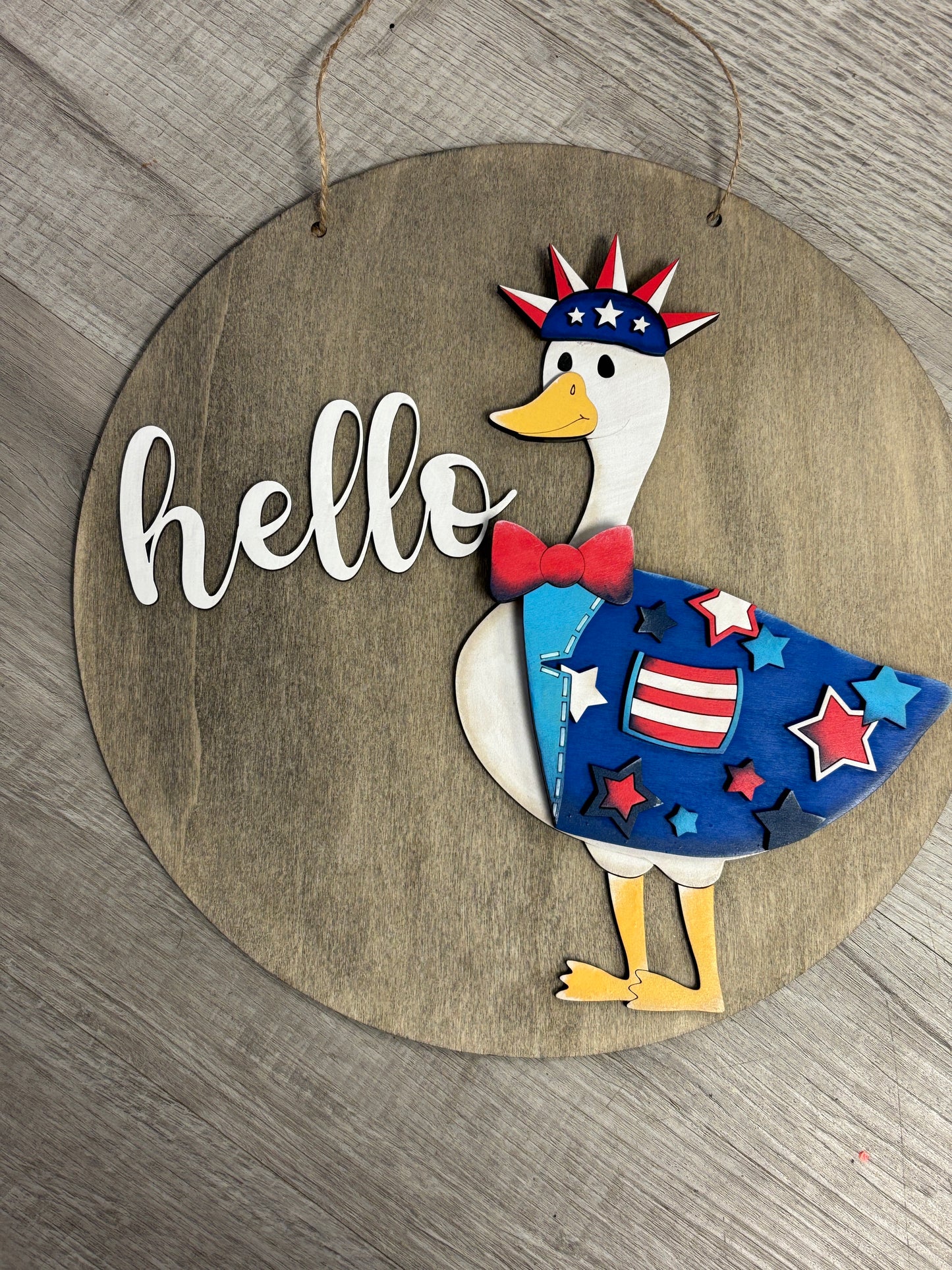 Interchangeable goose door hanger
