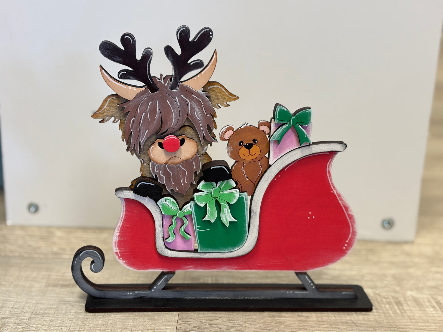 Highland cow Christmas sleigh