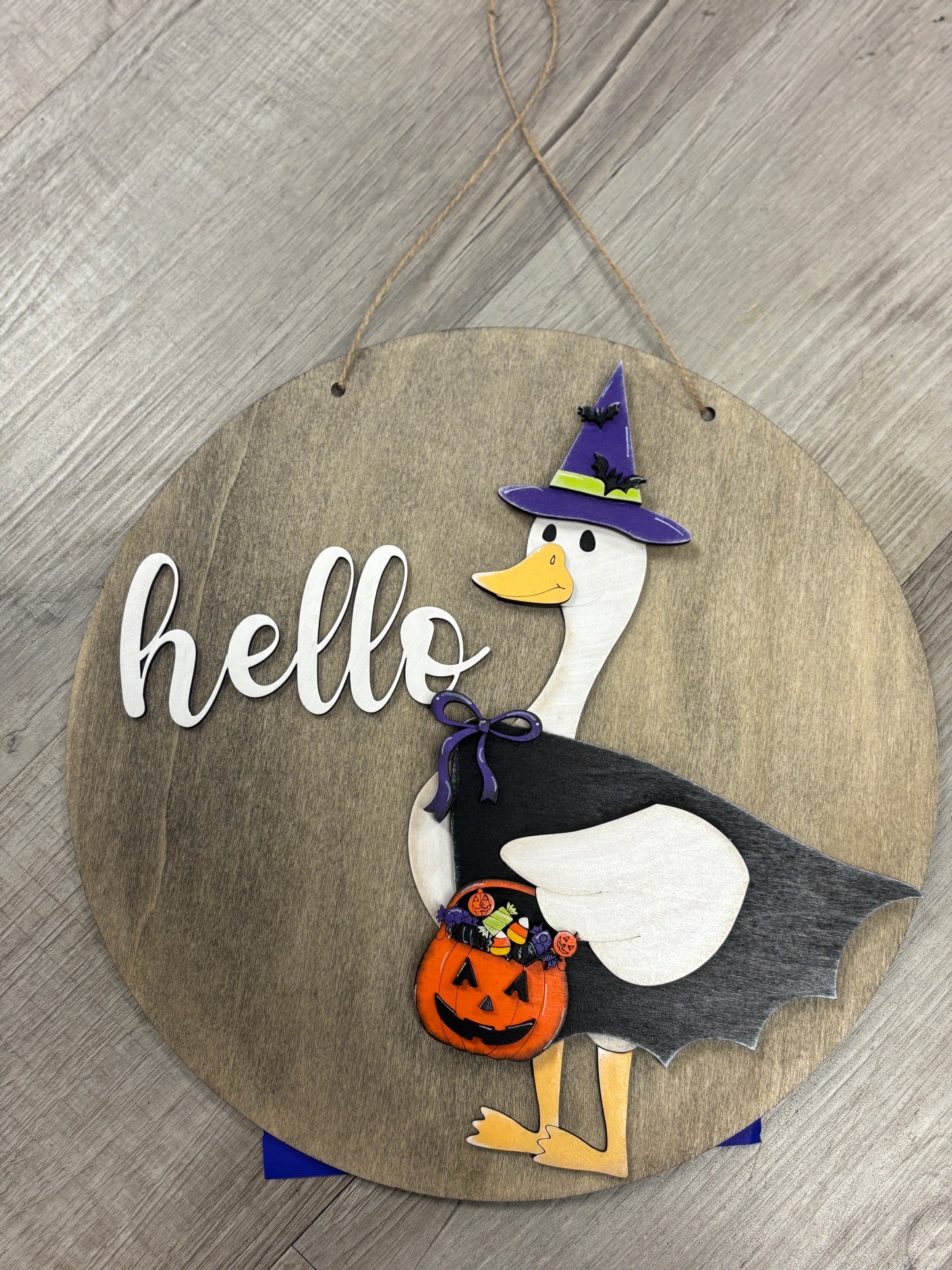 Interchangeable goose door hanger