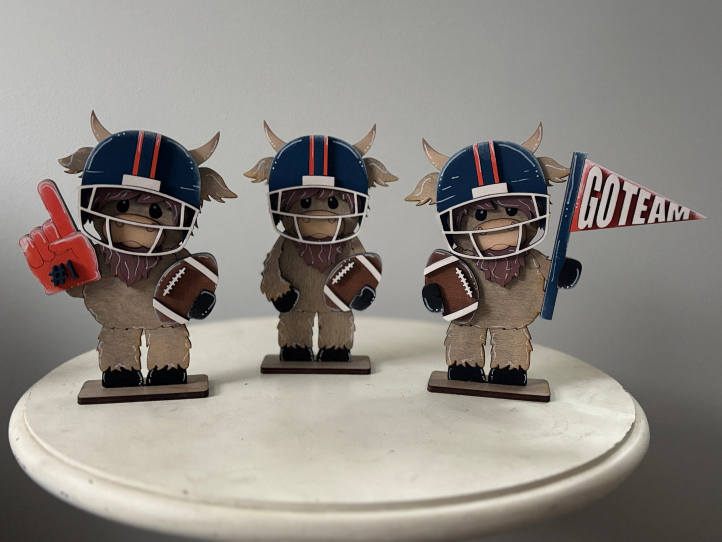 Mini standing highland cows- football & cheer