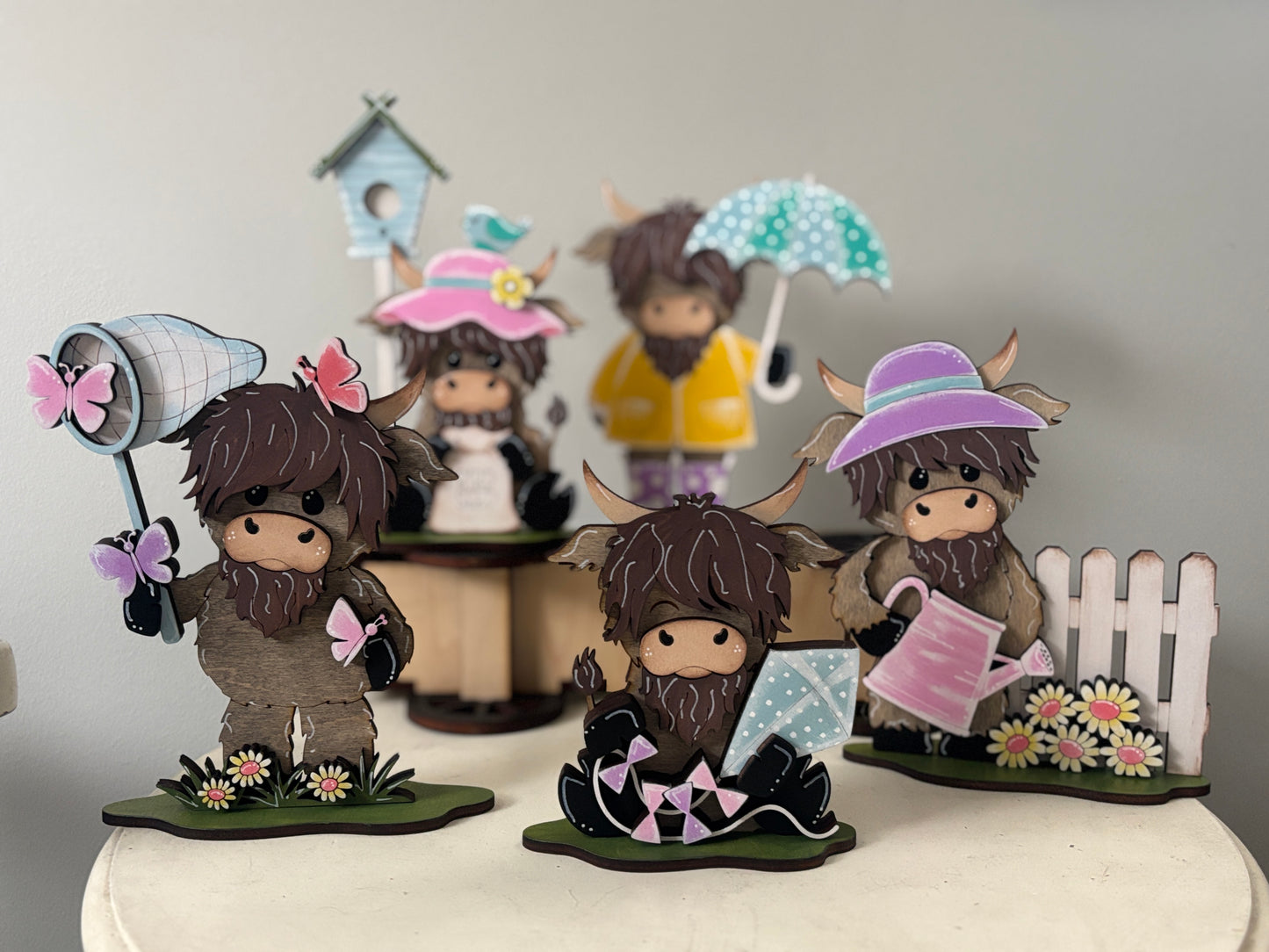 Spring mini standing highland cows