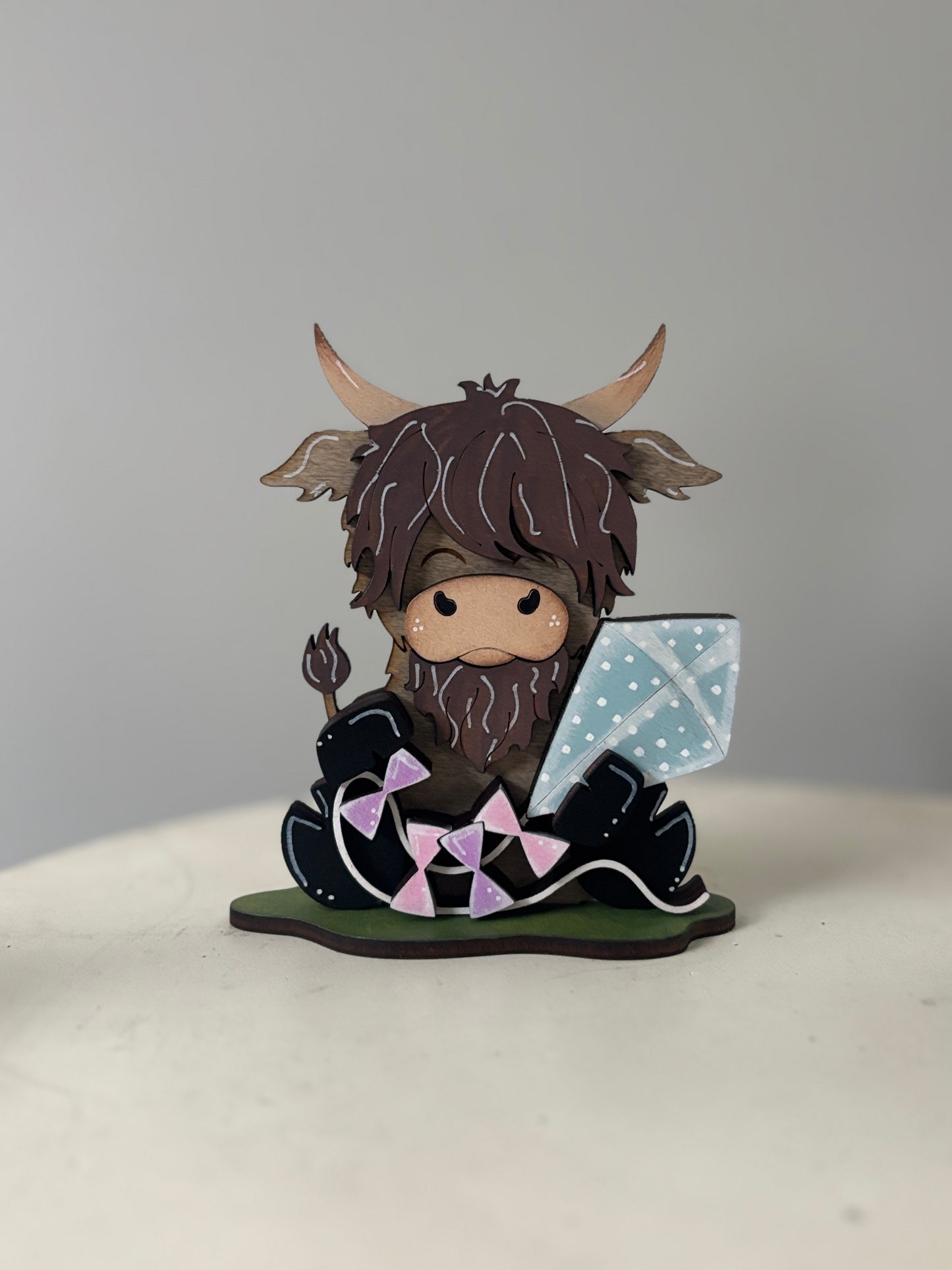 Spring mini standing highland cows