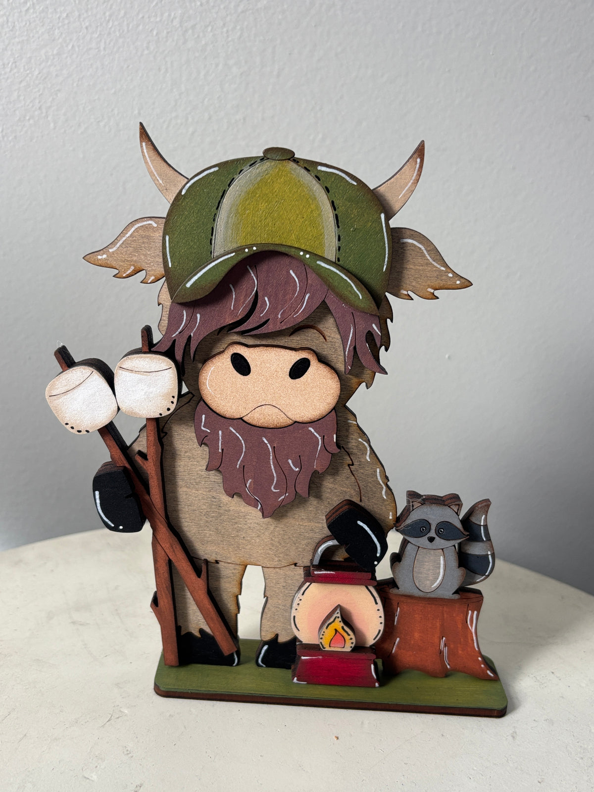 Camping and fishing standing highland cow