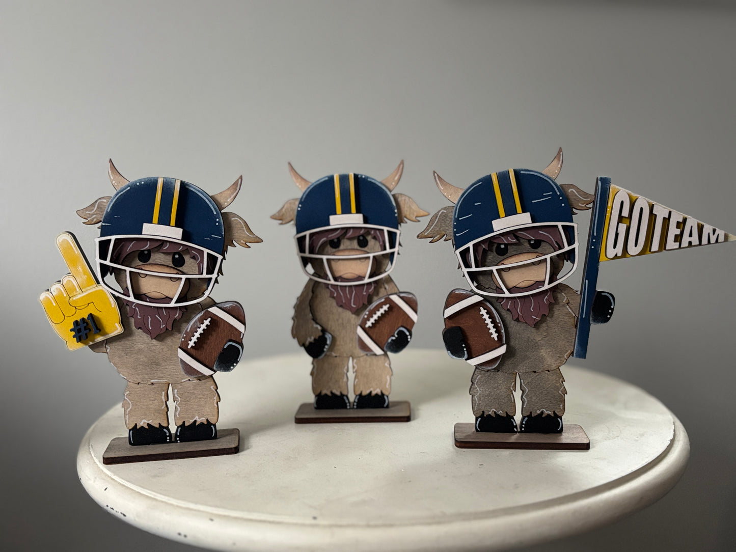 Mini standing highland cows- football & cheer