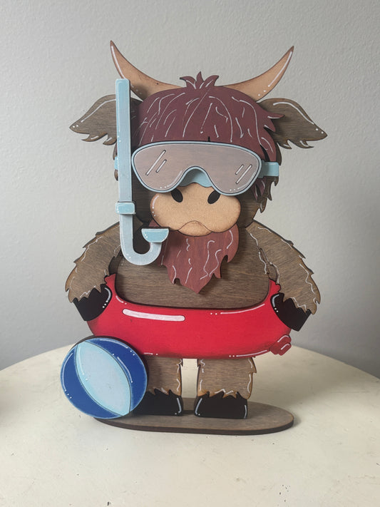 Summer standing highland cow
