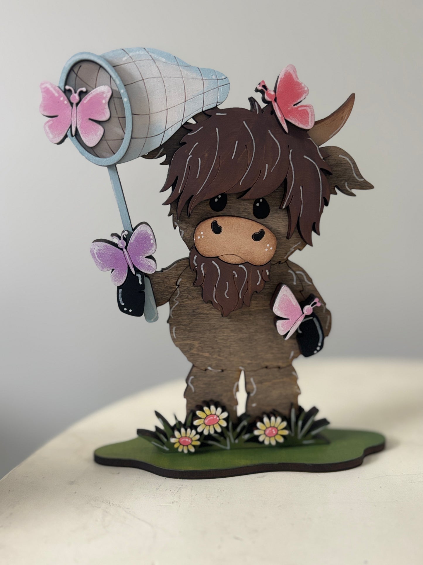Spring mini standing highland cows