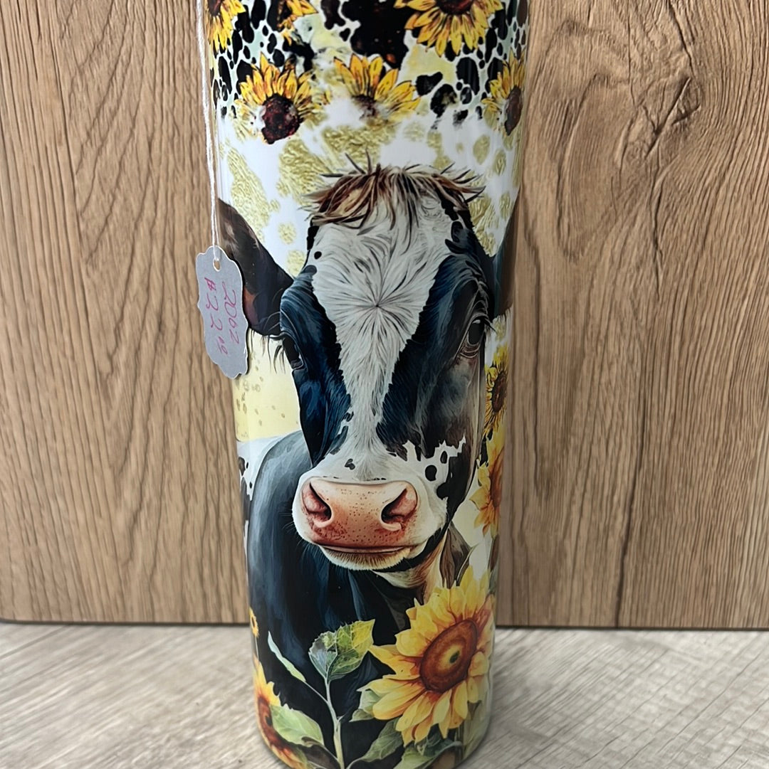 Cow with sunflowers